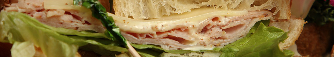 Eating Sandwich at Baldinos Giant Jersey Subs restaurant in Hephzibah, GA.